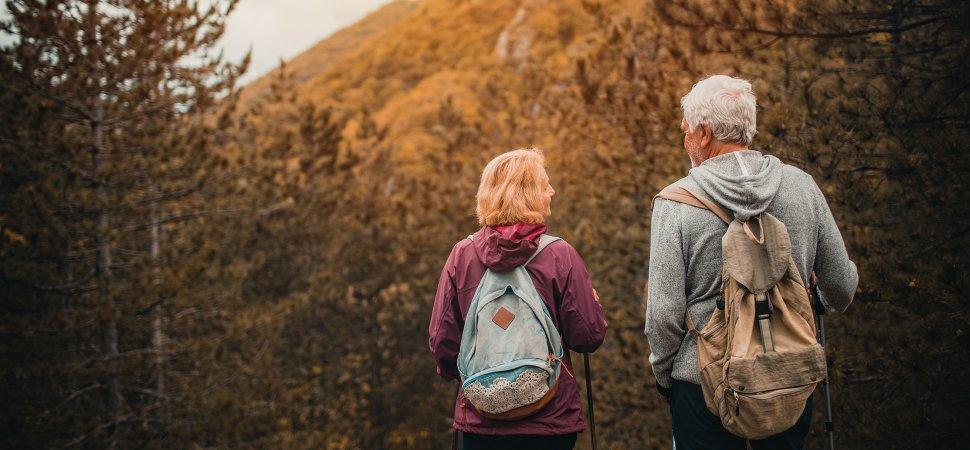 couple backpacking along a trail